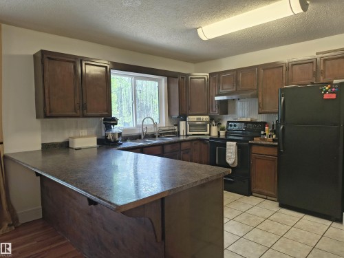 1, 49321 Range Road 72, Rural Brazeau County, AB - Indoor Photo Showing Kitchen With Double Sink