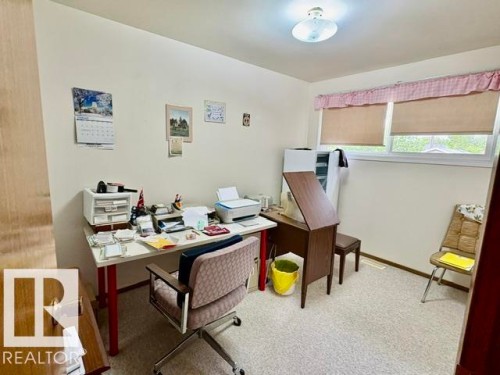 Room with light-toned walls, two windows, and a flush-mount ceiling light - 5454 46 Street, Vegreville, AB - Indoor Photo Showing Office