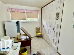 Room featuring light-colored wall-to-wall carpeting and white walls - 