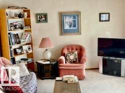 Light-toned walls complement the carpet flooring - 