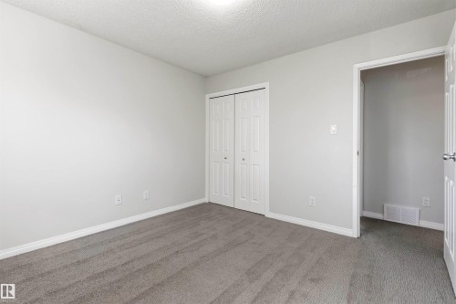 Neutral color palette with textured carpeting - 707 Clareview Road, Edmonton, AB - Indoor Photo Showing Other Room