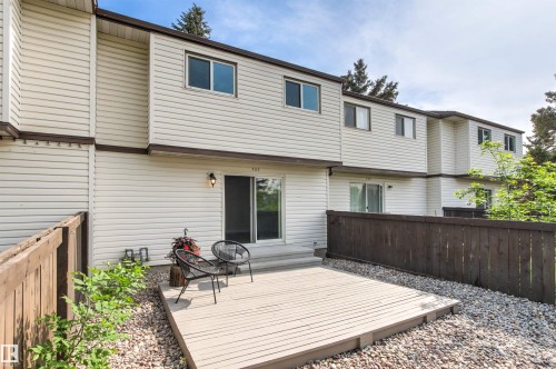 Private outdoor patio featuring wood decking and a sliding glass door - 707 Clareview Road, Edmonton, AB - Outdoor With Deck Patio Veranda With Exterior