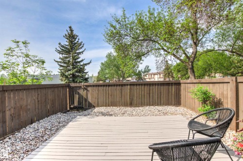Private patio area featuring a composite deck and a gravel border - 707 Clareview Road, Edmonton, AB - Outdoor With Deck Patio Veranda