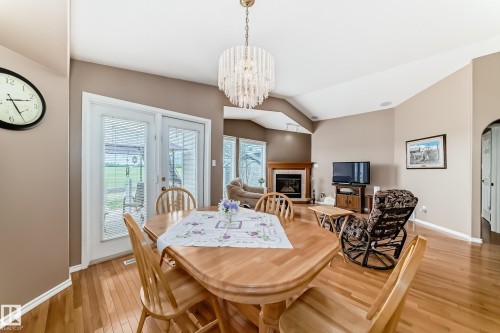 40 Heritage Crescent, Stony Plain, AB - Indoor Photo Showing Dining Room With Fireplace