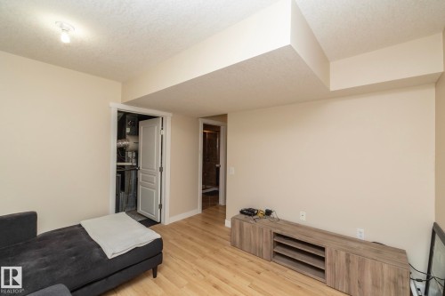 Interior room featuring light wood-finish flooring and neutral wall tones - 4204 161 Avenue, Edmonton, AB - Indoor