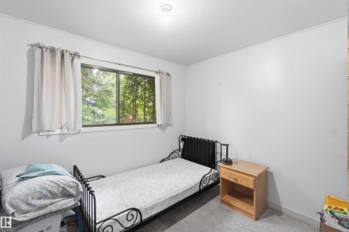 Room with light grey carpet and white walls - 16 Michigan Street, Devon, AB - Indoor Photo Showing Bedroom