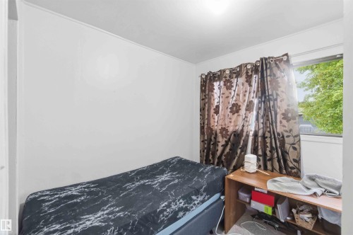 Room featuring a window with natural light, a light-colored ceiling, and white wall finishes - 16 Michigan Street, Devon, AB - Indoor Photo Showing Bedroom