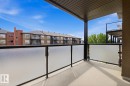 Private balcony featuring frosted glass panels and black railings - 312 13908 136 Street Nw, Edmonton, AB  - Outdoor With Balcony With Exterior 