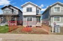 Contemporary two-story residence featuring light gray siding and white trim accents - 6092 179 Ave Nw, Edmonton, AB  - Outdoor With Facade 