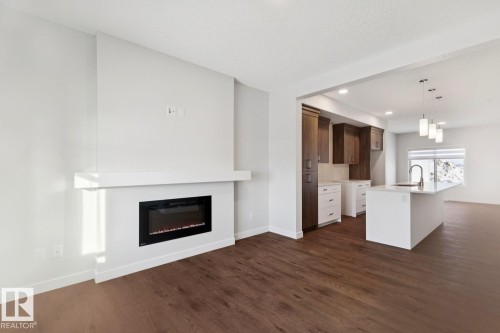 1081 Berg Place, Leduc, AB - Indoor Photo Showing Living Room With Fireplace