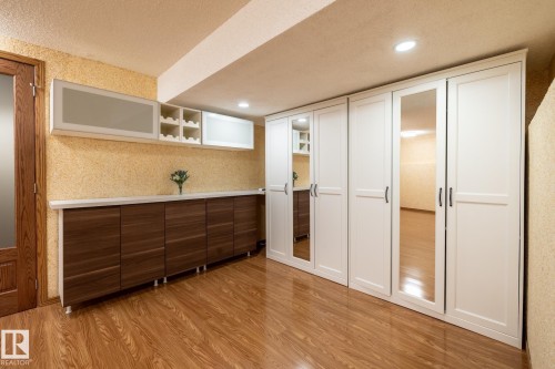 Wood-finish flooring throughout - 4632 151 Street, Edmonton, AB - Indoor Photo Showing Other Room