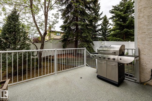 Private outdoor deck with a textured, light-colored surface - 4632 151 Street, Edmonton, AB - Outdoor With Exterior