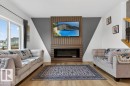 371 Bluff Cv, Leduc, AB  - Indoor Photo Showing Living Room With Fireplace 