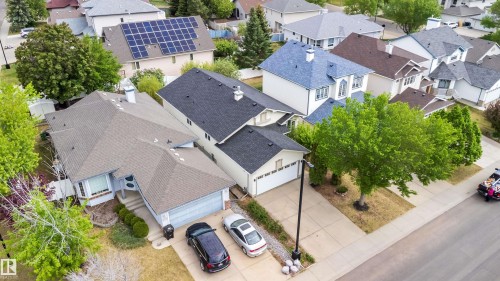 Expansive residential property featuring a multiple-pitched roofline and a two-car garage - 1212 Ormsby Lane, Edmonton, AB - Outdoor With View