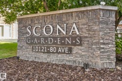 Stone veneer monument sign featuring raised lettering for property identification - 