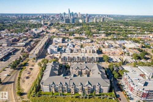 Aerial perspective showcasing a multi-unit residential building with a central courtyard - 334 10121 80 Avenue, Edmonton, AB - Outdoor With View