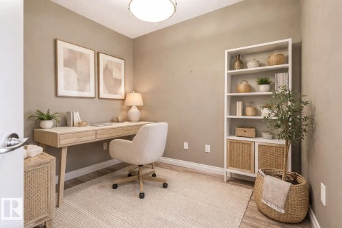 Neutral-toned room with wood-finish flooring and a ceiling-mounted light fixture - 334 10121 80 Avenue, Edmonton, AB - Indoor Photo Showing Office
