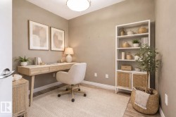 Neutral-toned room with wood-finish flooring and a ceiling-mounted light fixture - 