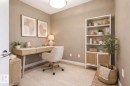 Neutral-toned room with wood-finish flooring and a ceiling-mounted light fixture - 334 10121 80 Avenue, Edmonton, AB  - Indoor Photo Showing Office 
