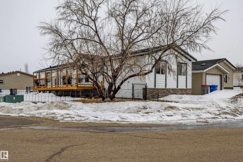 White siding exterior with a dark roof and decorative stone skirting - 1529 Range Road 272 Rural Parkland County, Alberta, Rural Parkland County, AB - Outdoor