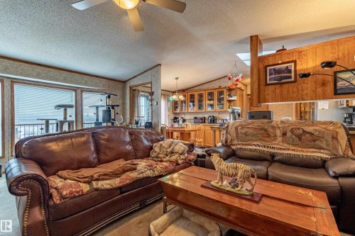 Open concept living area featuring a vaulted ceiling and skylights - 1529 Range Road 272 Rural Parkland County, Alberta, Rural Parkland County, AB - Indoor Photo Showing Living Room