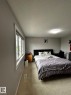 Room featuring light gray painted walls and light-colored carpet flooring - 1868 30 Street Nw, Edmonton, AB  - Indoor Photo Showing Bedroom 