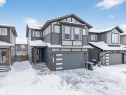 Contemporary residence featuring a multi-tone facade with horizontal siding and stone accents - 6085 King Landing, Edmonton, AB  - Outdoor With Facade 