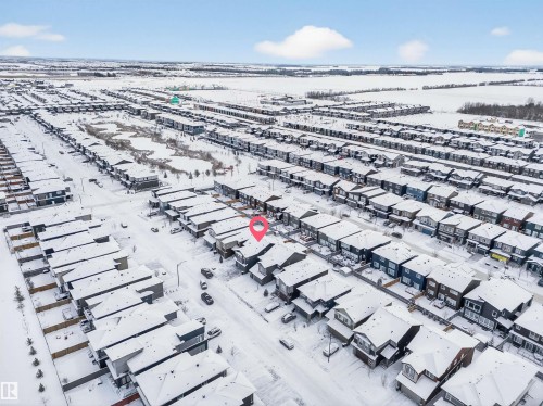 Aerial perspective of a developed residential area featuring a dense arrangement of detached homes and townhouses - 6085 King Landing, Edmonton, AB - Outdoor With View
