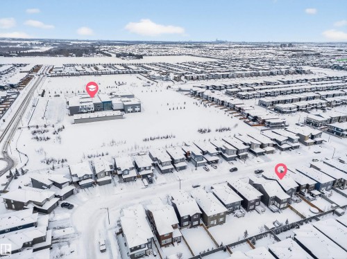 Aerial view showcasing a residential neighborhood with a contemporary school building - 6085 King Landing, Edmonton, AB - Outdoor With View