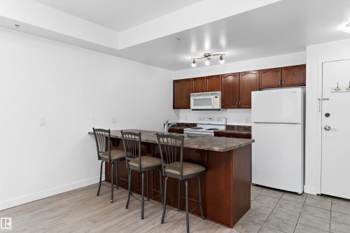 902 9939 109 Street, Edmonton, AB - Indoor Photo Showing Other Room With Fireplace