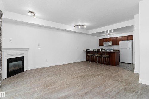 902 9939 109 Street, Edmonton, AB - Indoor Photo Showing Living Room With Fireplace