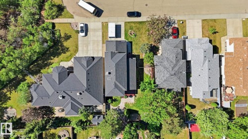 Residential property featuring a multi-gabled roofline and surrounding mature trees - 4309 37A Avenue, Edmonton, AB - Outdoor