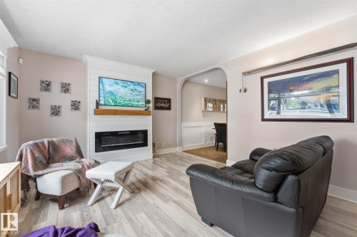 5400 49 Street, Stony Plain, AB - Indoor Photo Showing Living Room With Fireplace