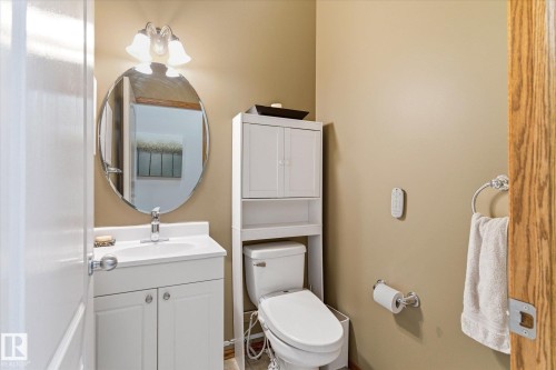 Bathroom with white vanity, integrated sink, and chrome faucet - 442 Hunters Green, Edmonton, AB - Indoor Photo Showing Bathroom
