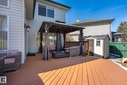 Expansive wooden deck featuring an integrated gazebo and a utility shed - 442 Hunters Green, Edmonton, AB - Outdoor With Deck Patio Veranda With Exterior