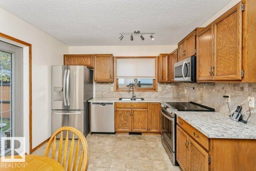 4923 11A Avenue, Edmonton, AB - Indoor Photo Showing Kitchen With Double Sink