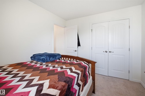 Bedroom featuring light beige carpeting, white walls, and a white ceiling - 1523 36 Avenue, Edmonton, AB - Indoor Photo Showing Bedroom