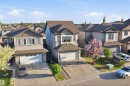 Contemporary suburban home featuring a two-car garage, concrete driveway, and a prominent front bay window - 1523 36 Avenue, Edmonton, AB  - Outdoor With Facade 
