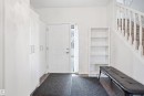 Entryway featuring bright white walls, wood-finish flooring, and a traditional white paneled door with sidelight - 1523 36 Avenue, Edmonton, AB  - Indoor Photo Showing Other Room 