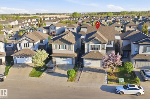 Modern suburban residential property featuring a gray and white exterior with dark brown roofing - 1523 36 Avenue, Edmonton, AB - Outdoor With Facade