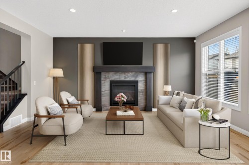 Living room - 17838 60A Street, Edmonton, AB - Indoor Photo Showing Living Room With Fireplace
