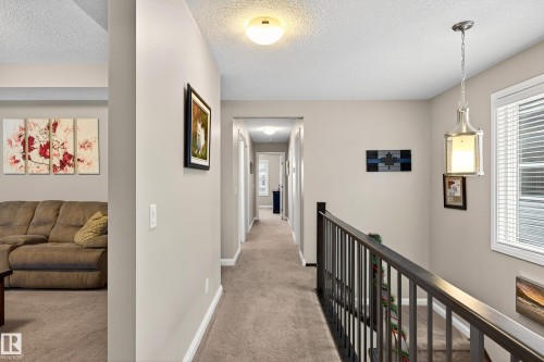 Upper-level hallway featuring neutral wall tones and plush carpet flooring - 17838 60A Street, Edmonton, AB - Indoor Photo Showing Other Room
