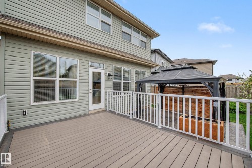 Spacious outdoor deck featuring composite decking, white railing, and direct access to the interior - 17838 60A Street, Edmonton, AB - Outdoor With Deck Patio Veranda With Exterior