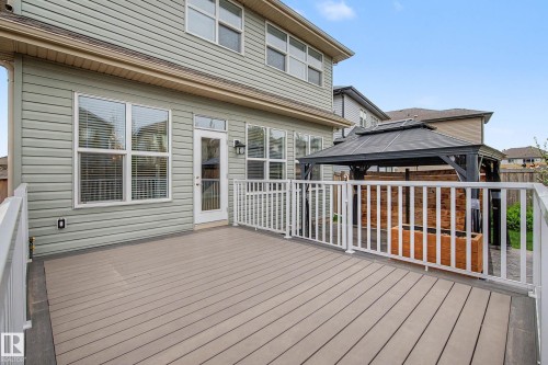 Expansive composite decking with white railings - 17838 60A Street, Edmonton, AB - Outdoor With Deck Patio Veranda With Exterior