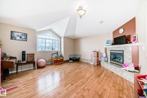 1815 36 Avenue, Edmonton, AB - Indoor Photo Showing Other Room With Fireplace