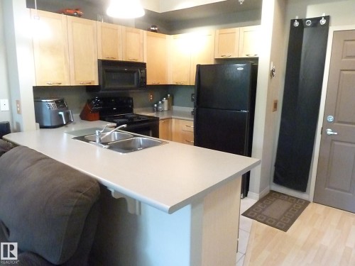 1-104 4245 139 Avenue, Edmonton, AB - Indoor Photo Showing Kitchen With Double Sink