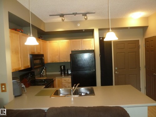 1-104 4245 139 Avenue, Edmonton, AB - Indoor Photo Showing Kitchen With Double Sink