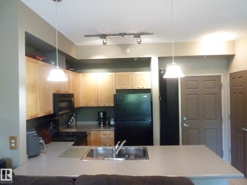 1-104 4245 139 Avenue, Edmonton, AB - Indoor Photo Showing Kitchen With Double Sink