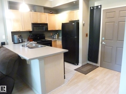 1-104 4245 139 Avenue, Edmonton, AB - Indoor Photo Showing Kitchen With Double Sink
