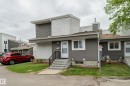 Multi-level exterior featuring horizontal siding and white brick accents - 5626 19A Avenue, Edmonton, AB 
